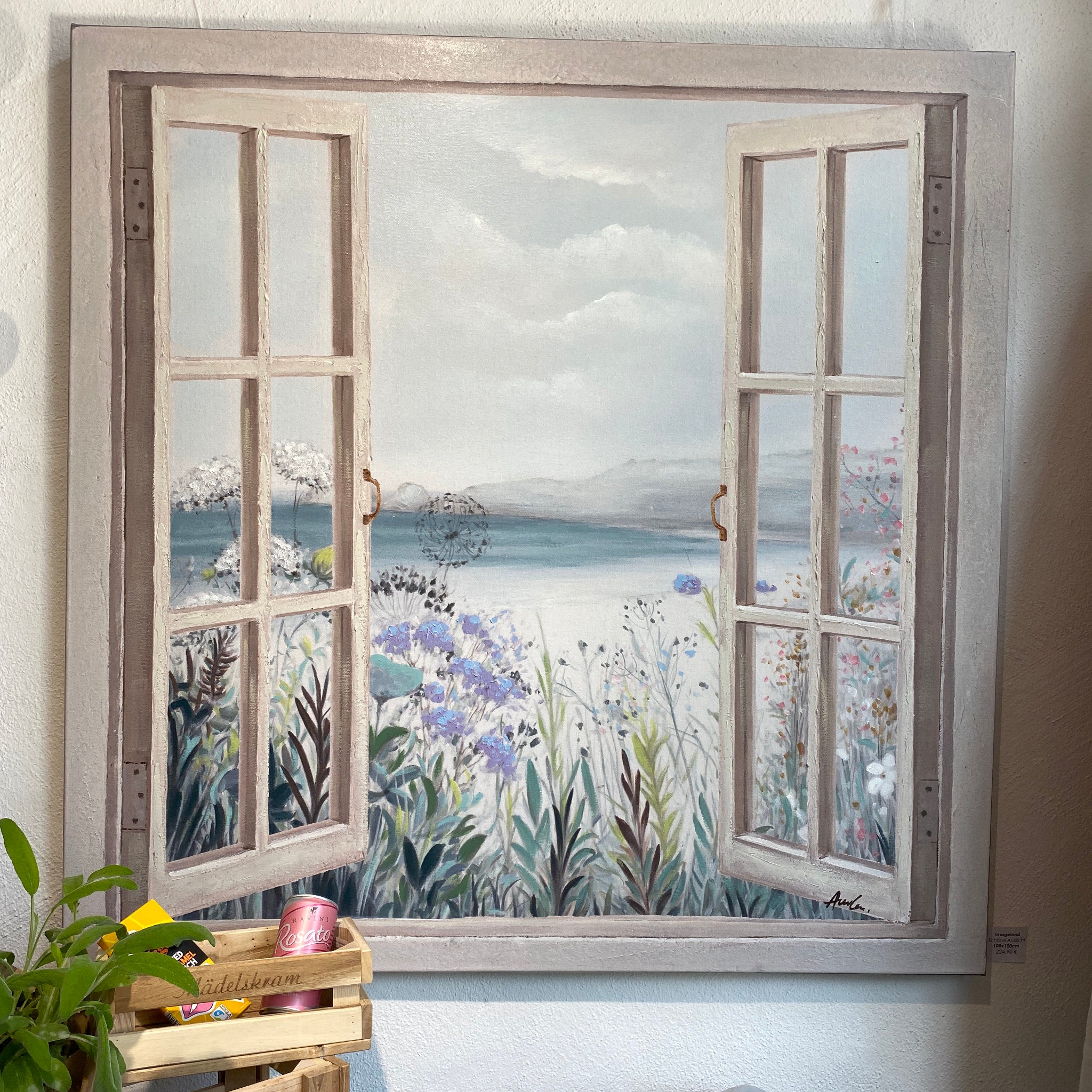 Ein Gemälde, dass die Aussicht auf einen Strand durch ein Fenster bietet | Flinterhoff - Für dich und mich